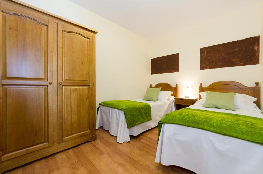 Postel nebo postele na pokoji v ubytování Hotel Apolo