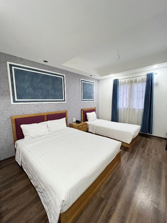 Postel nebo postele na pokoji v ubytování Holiday Suites Hotel & Spa