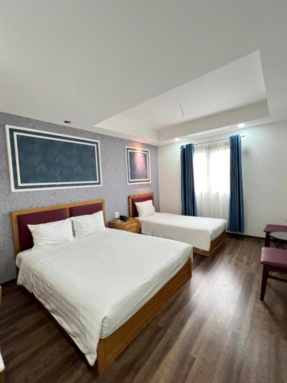 Postel nebo postele na pokoji v ubytování Holiday Suites Hotel & Spa