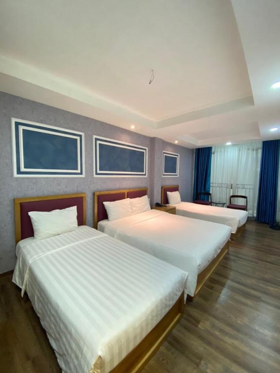 Postel nebo postele na pokoji v ubytování Holiday Suites Hotel & Spa