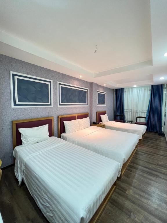 Postel nebo postele na pokoji v ubytování Holiday Suites Hotel & Spa