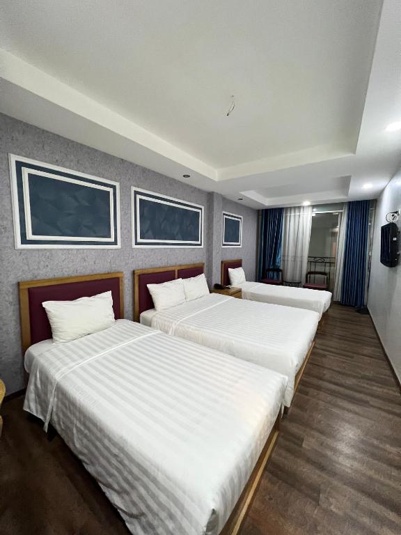 Postel nebo postele na pokoji v ubytování Holiday Suites Hotel & Spa