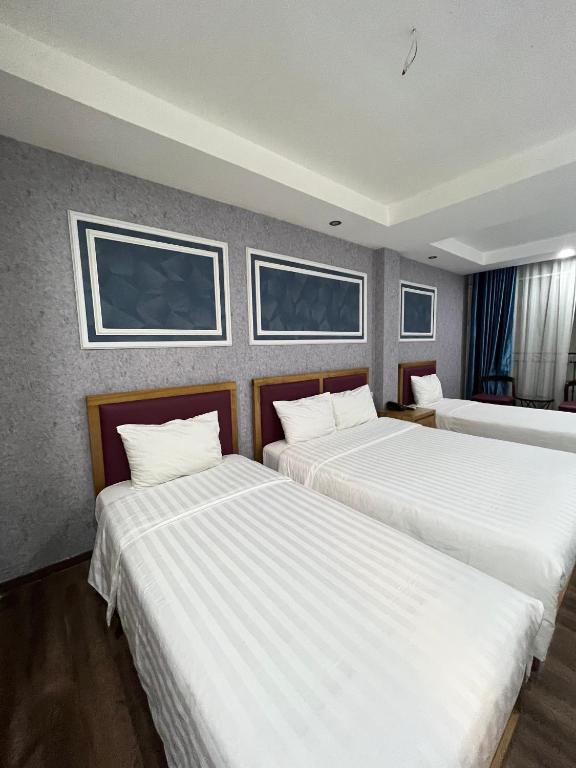 Postel nebo postele na pokoji v ubytování Holiday Suites Hotel & Spa