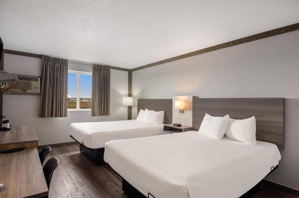 Postel nebo postele na pokoji v ubytování Econo Lodge Scottsbluff