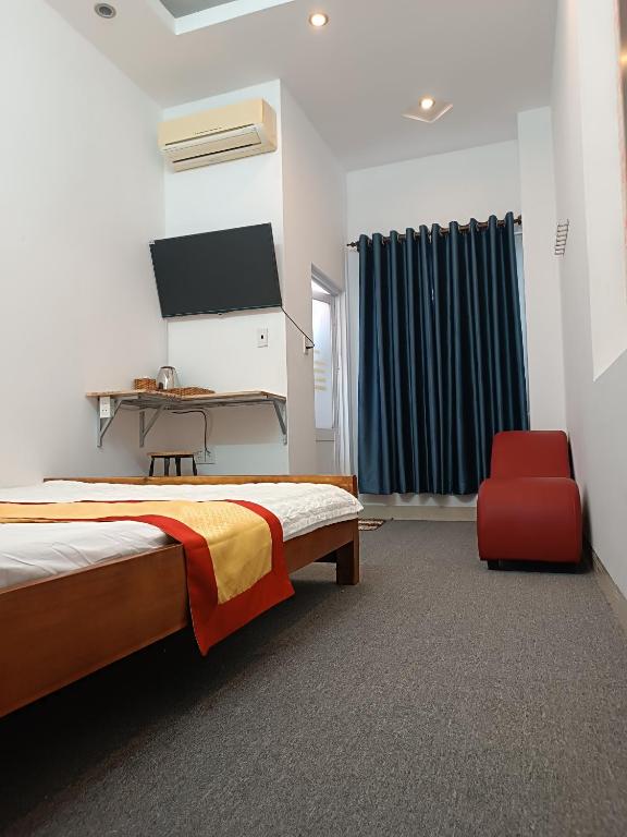 Postel nebo postele na pokoji v ubytování Motel Toàn Thắng