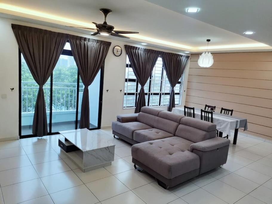 a living room with a couch and a table at SkyView in Johor Bahru