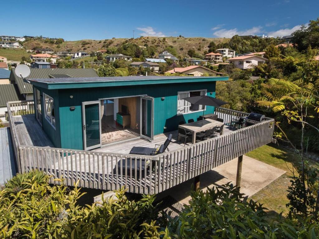 an aerial view of a house with a large deck at Mon Coeur Holiday Home in Kaiteriteri