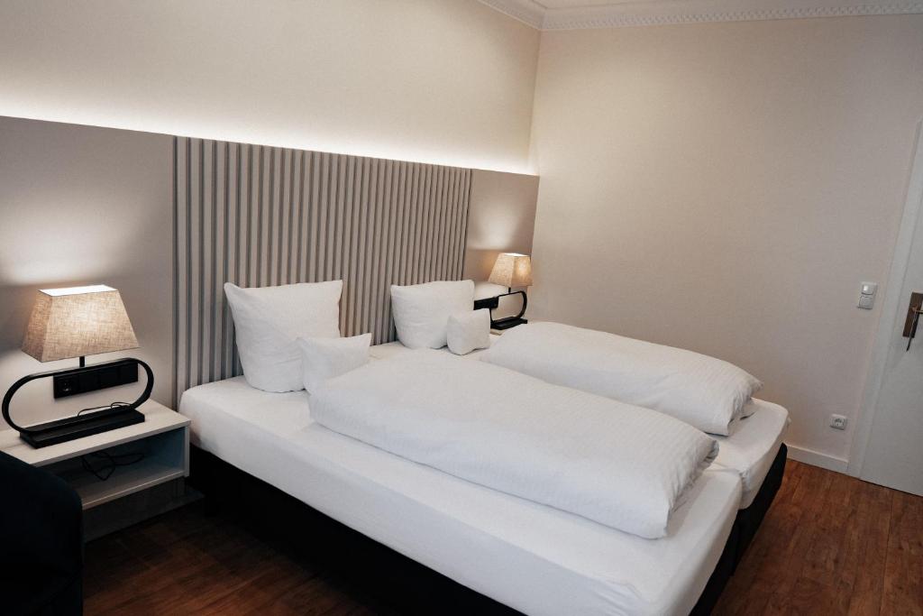Postel nebo postele na pokoji v ubytování Hotel Fletzinger