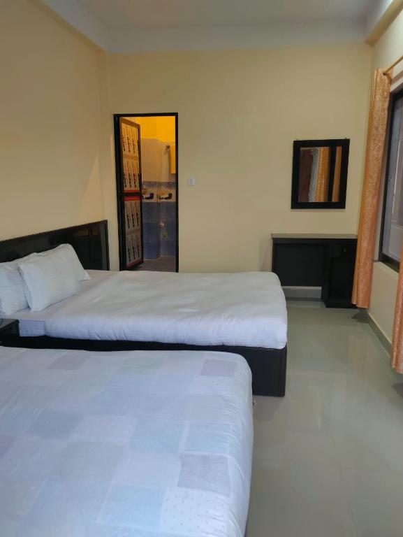Postel nebo postele na pokoji v ubytování Kavre Guest House