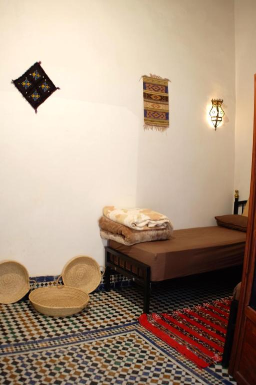 Postel nebo postele na pokoji v ubytování Riad Mikou
