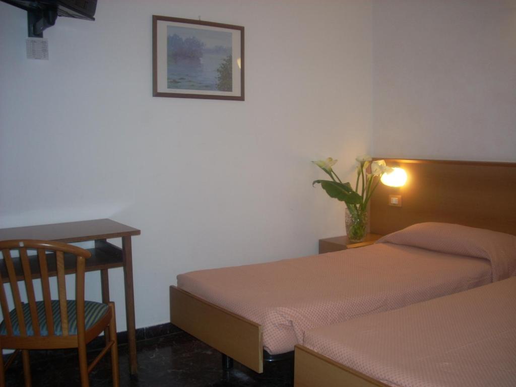 Postel nebo postele na pokoji v ubytování Hotel Corallo
