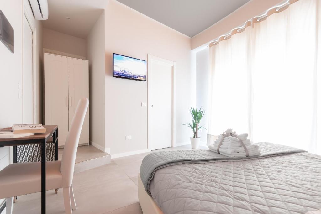 Postel nebo postele na pokoji v ubytování PhotoGuest B&B