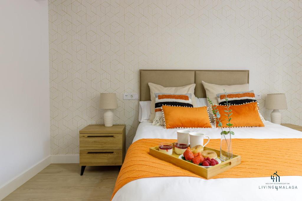 Posteľ alebo postele v izbe v ubytovaní Living4Malaga Boho Chic Apartment