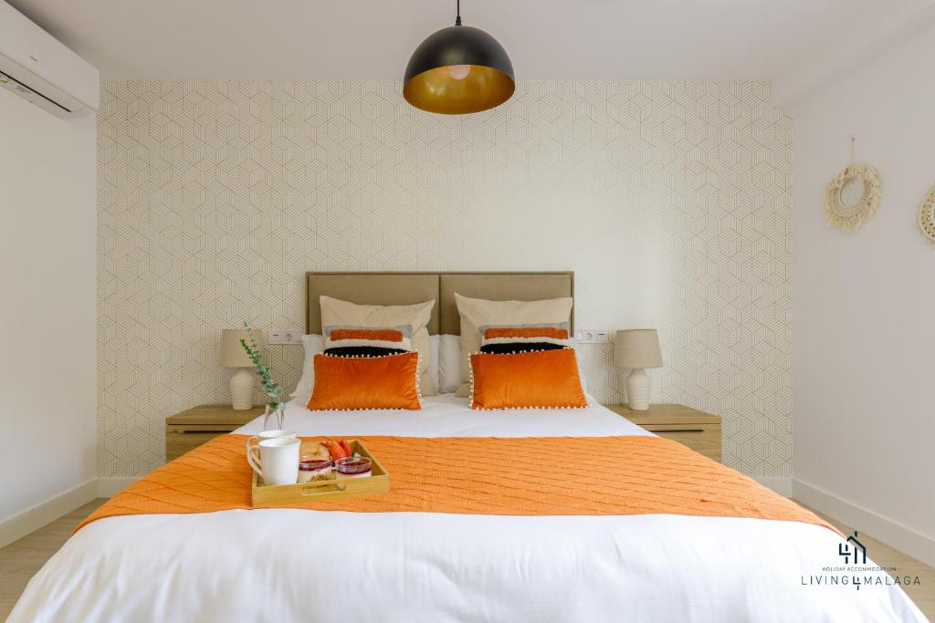 Posteľ alebo postele v izbe v ubytovaní Living4Malaga Boho Chic Apartment