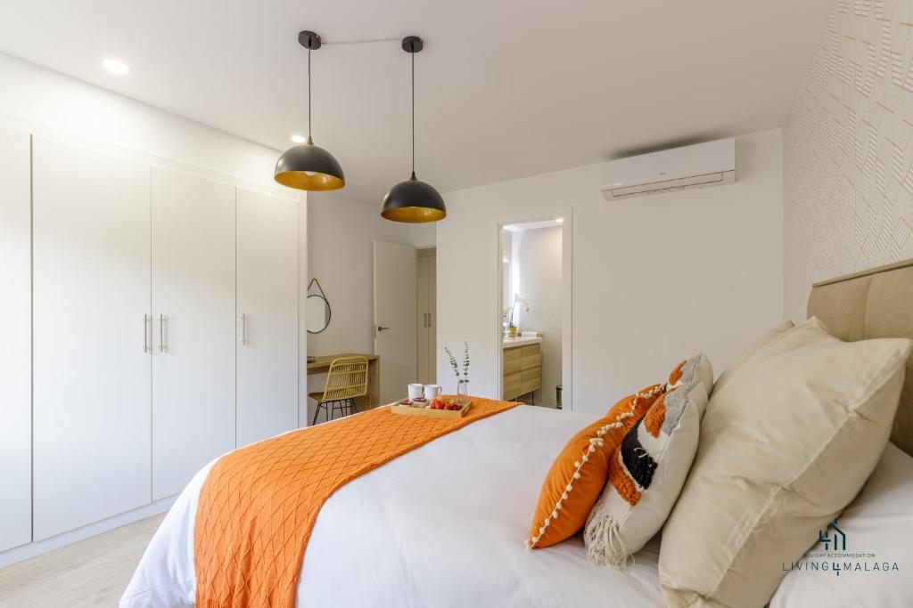 Posteľ alebo postele v izbe v ubytovaní Living4Malaga Boho Chic Apartment