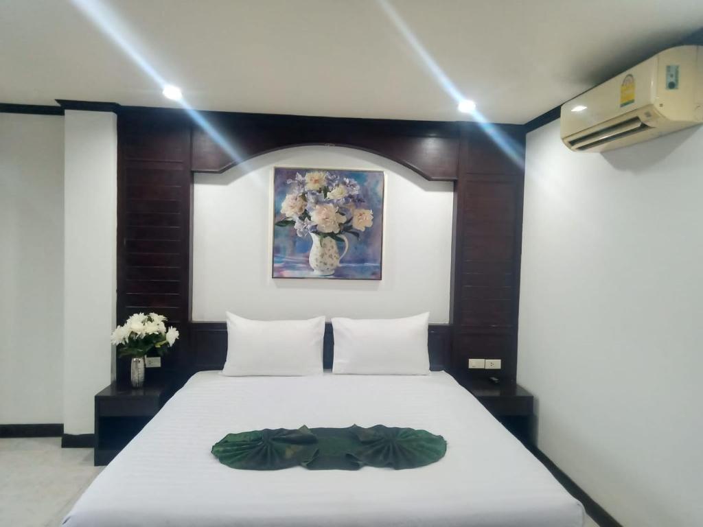 Cama o camas de una habitación en Cocoon Sansabai Guesthouse