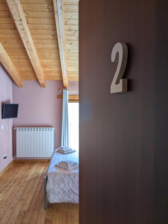 Postel nebo postele na pokoji v ubytování CONSTANCIA TRATTORIA