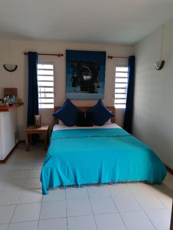 Postel nebo postele na pokoji v ubytování Terre et Mer - Studios - Ile Maurice