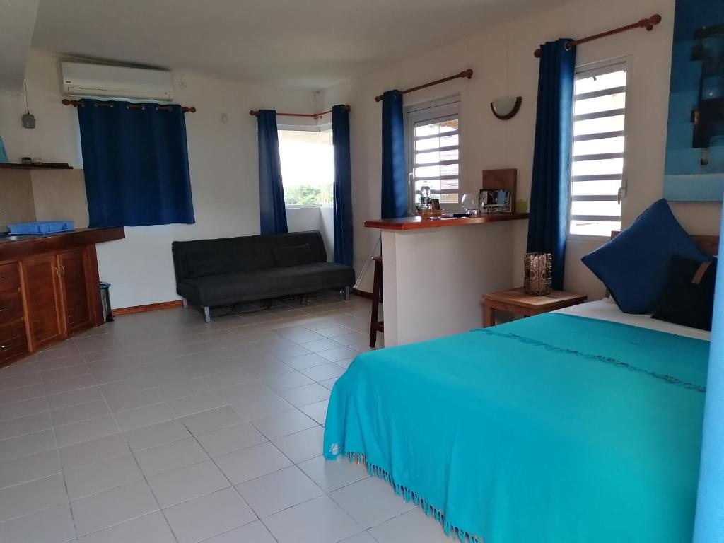 Postel nebo postele na pokoji v ubytování Terre et Mer - Studios - Ile Maurice