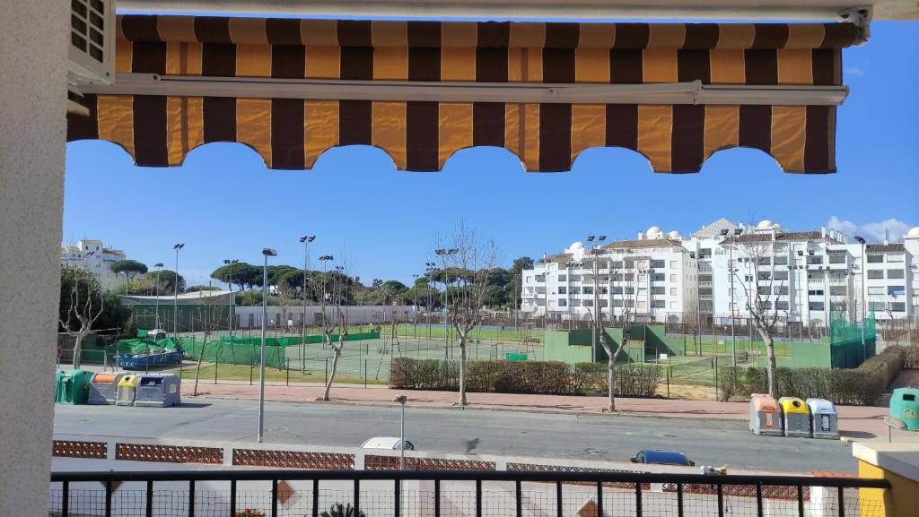 a view of a parking lot with buildings in the background at Apartamento en el Portil in El Portil