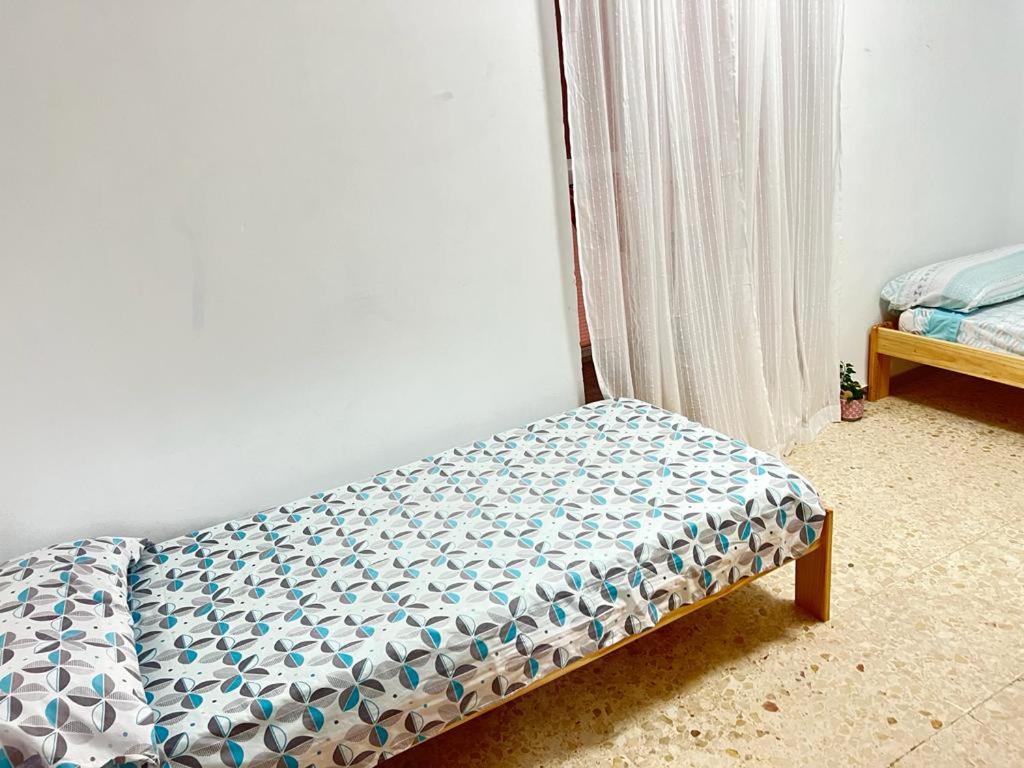 Posteľ alebo postele v izbe v ubytovaní Apartamento COCO a primera linea de MAR