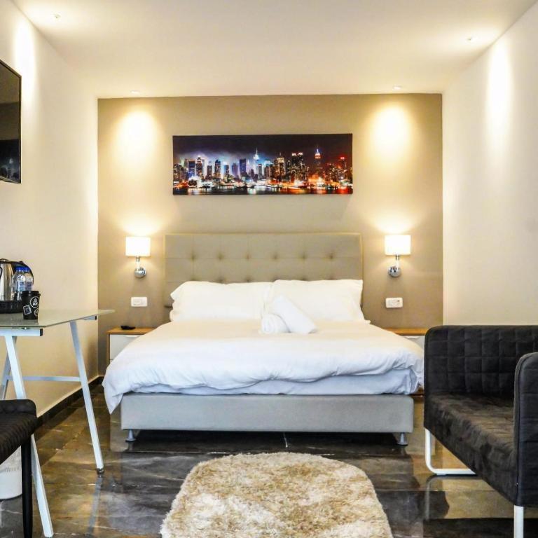 Postel nebo postele na pokoji v ubytování Elven Hotel