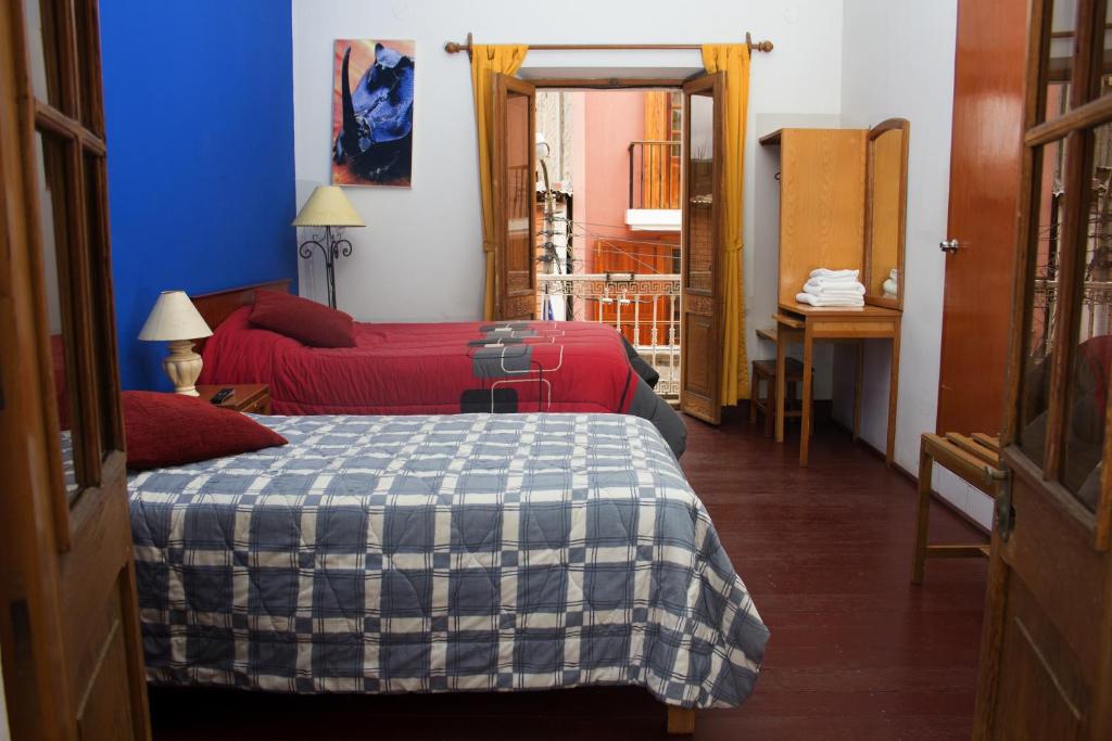 Postel nebo postele na pokoji v ubytování Posada Nueva España