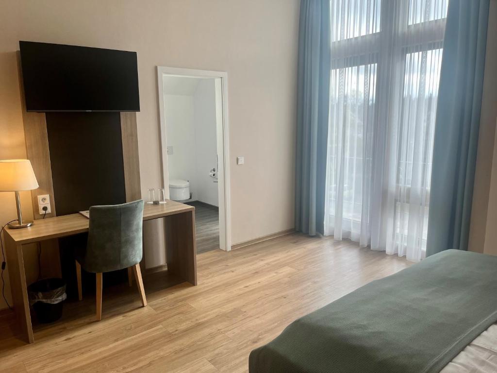 Postel nebo postele na pokoji v ubytování Troll's Brauhaushotel