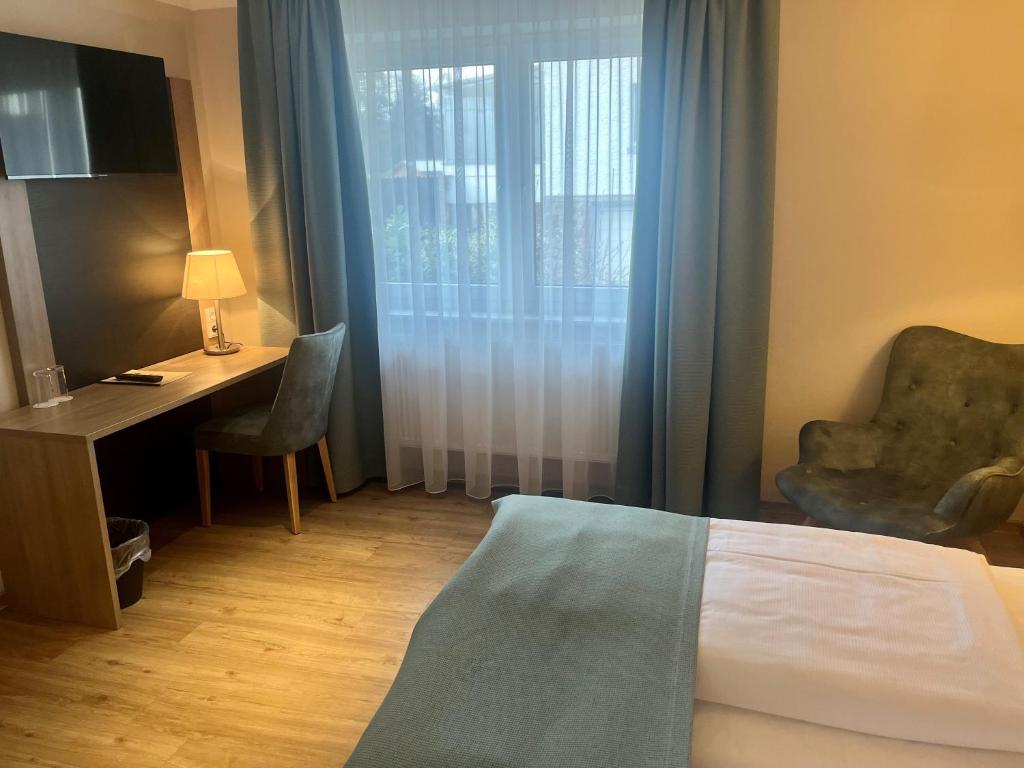 Postel nebo postele na pokoji v ubytování Troll's Brauhaushotel