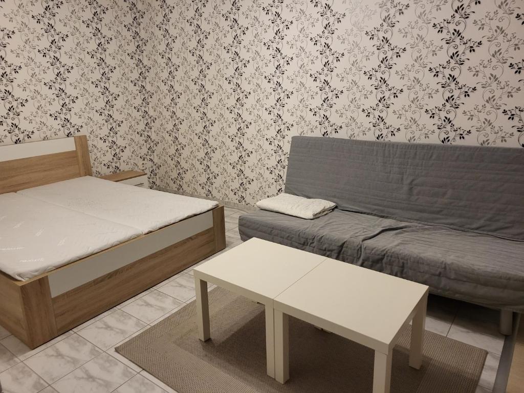 Postel nebo postele na pokoji v ubytování Zwaan Apartmány