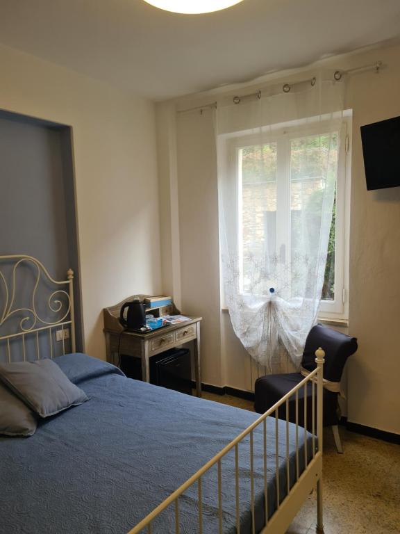 Postel nebo postele na pokoji v ubytování Pippo a Vernazza Rooms