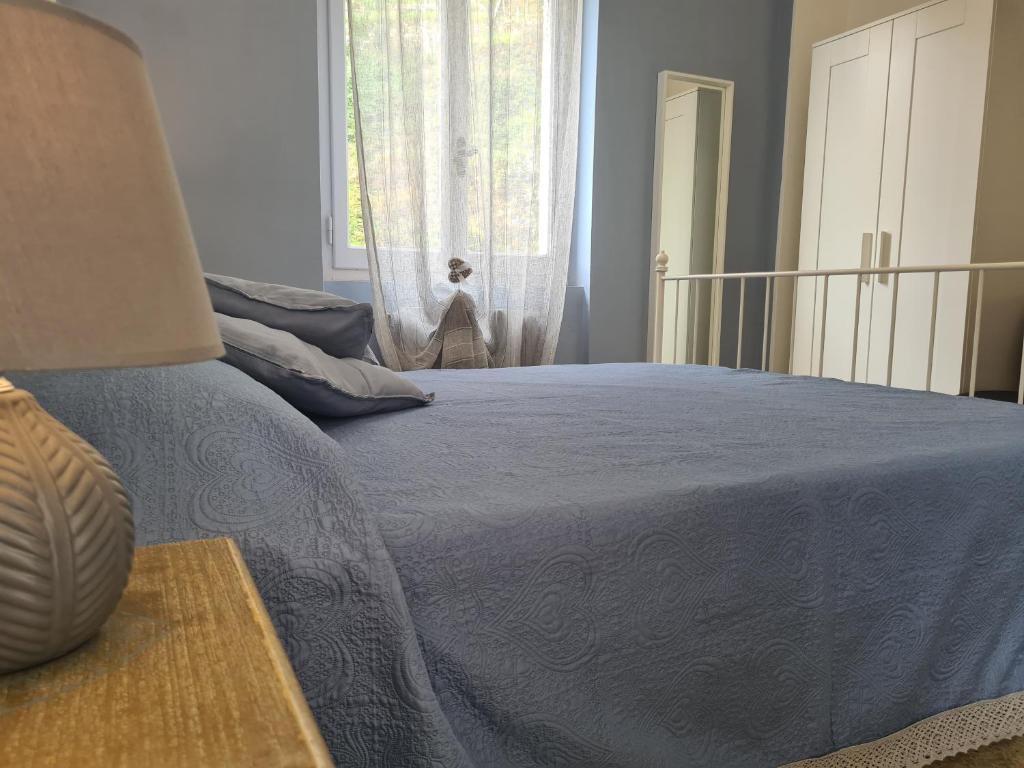 Postel nebo postele na pokoji v ubytování Pippo a Vernazza Rooms