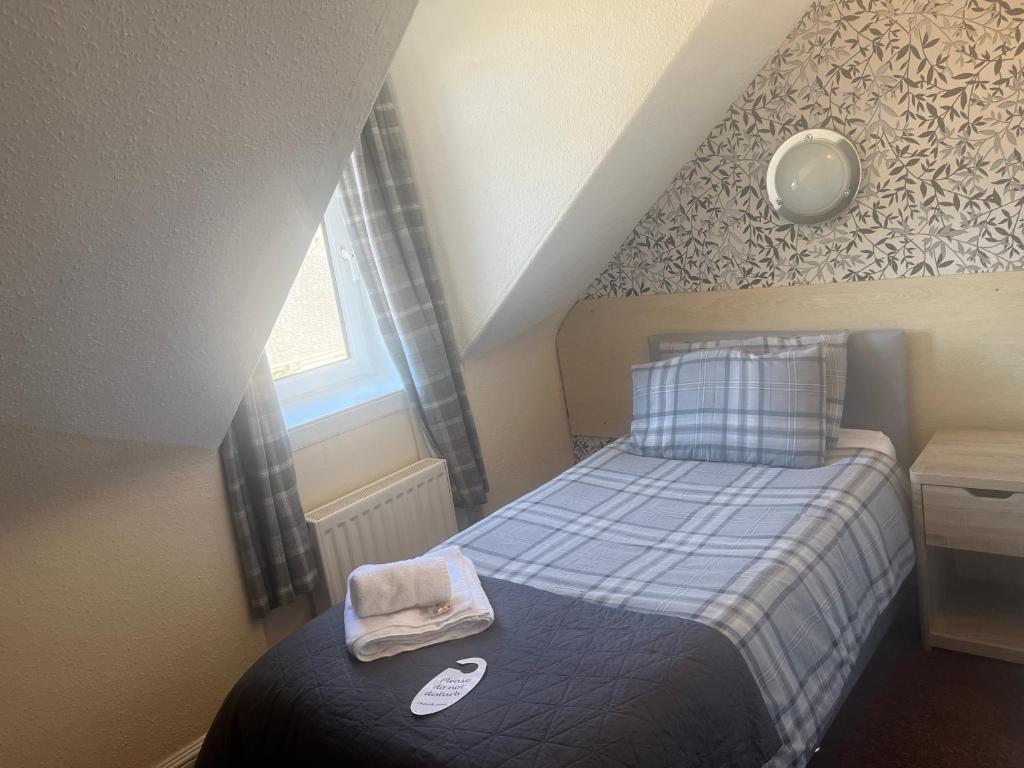 Letto o letti in una camera di DunMoore Guesthouse