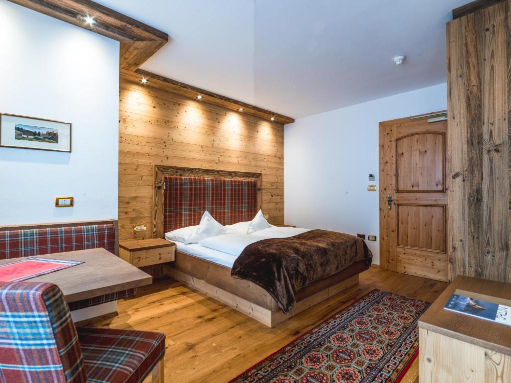 Postel nebo postele na pokoji v ubytování Garni Hotel Rosengarten B&B