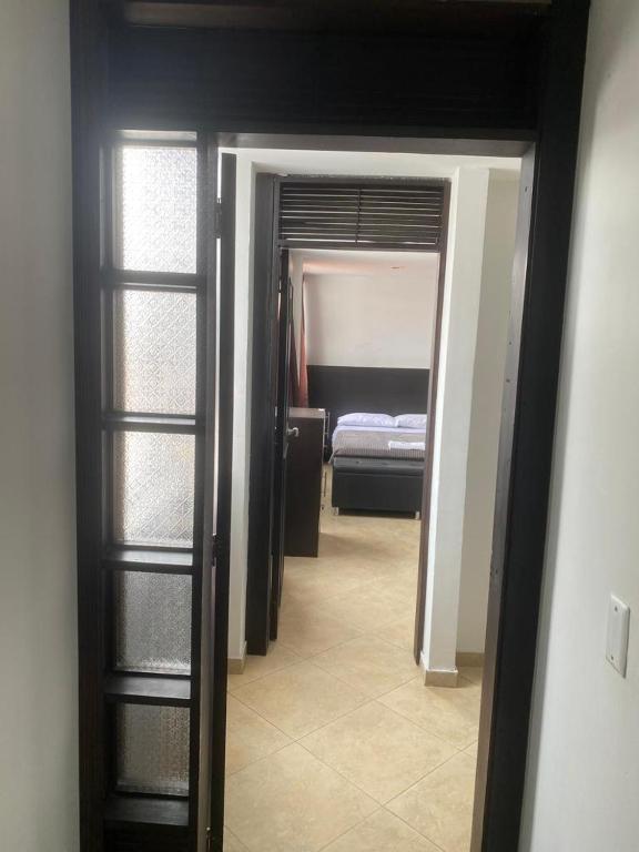 Postel nebo postele na pokoji v ubytování Destino Nómada Calle 11 n 1-38