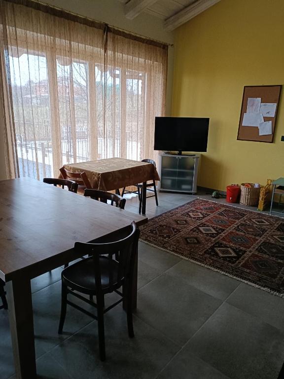 Televízia a/alebo spoločenská miestnosť v ubytovaní Rosatea B&B