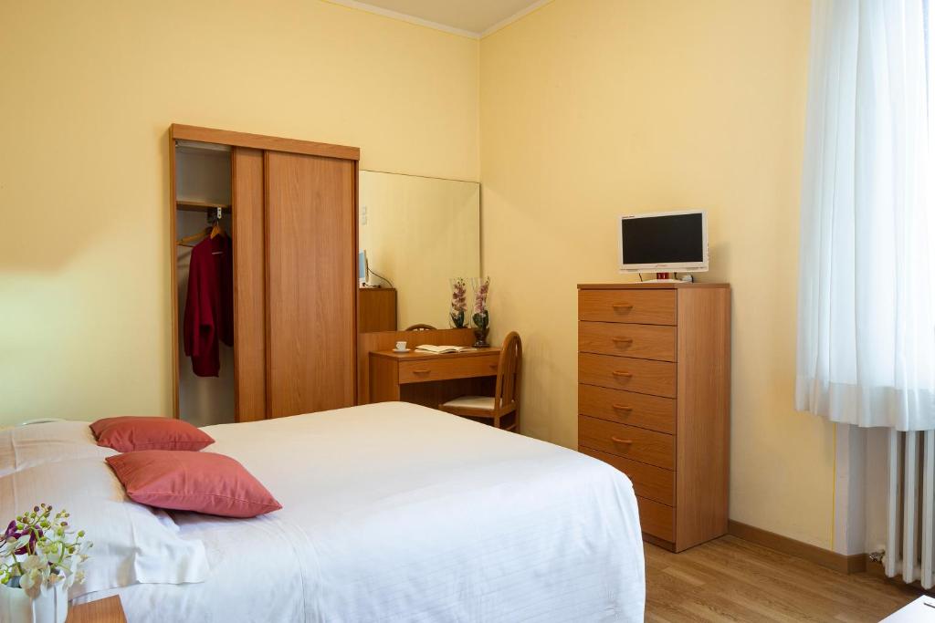 Posteľ alebo postele v izbe v ubytovaní Hotel Sacro Cuore