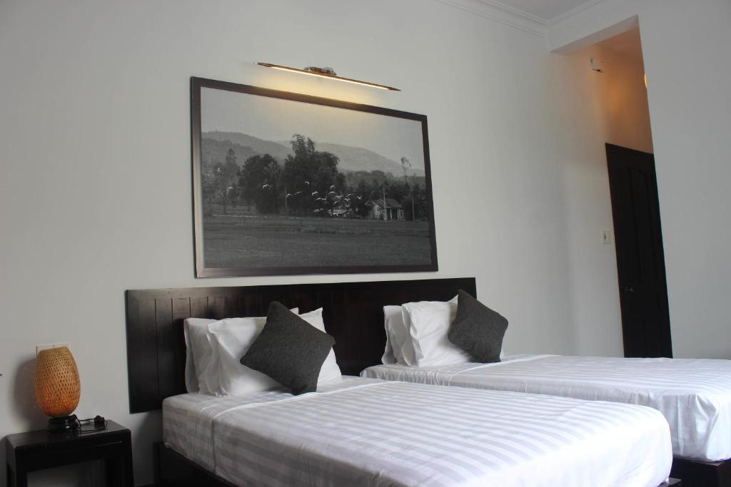 Postel nebo postele na pokoji v ubytování Hoi An Viet House Homestay