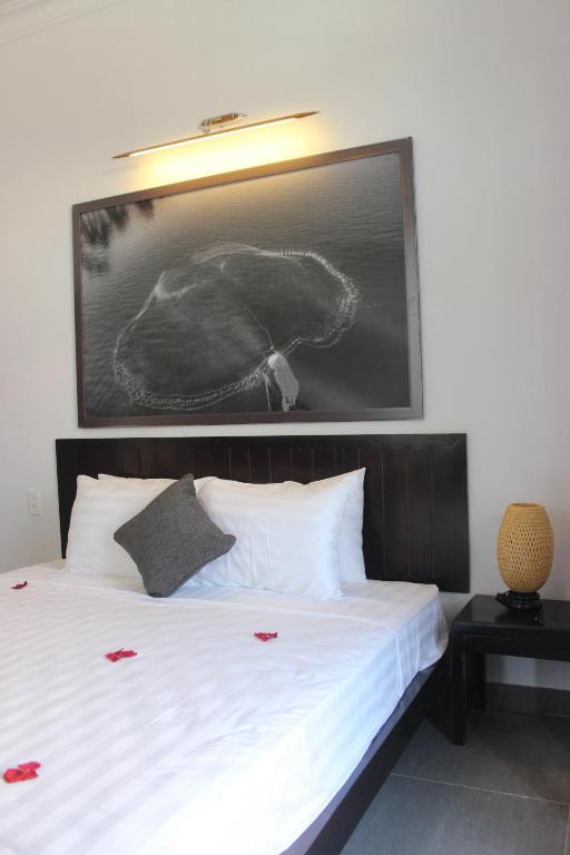 Postel nebo postele na pokoji v ubytování Hoi An Viet House Homestay