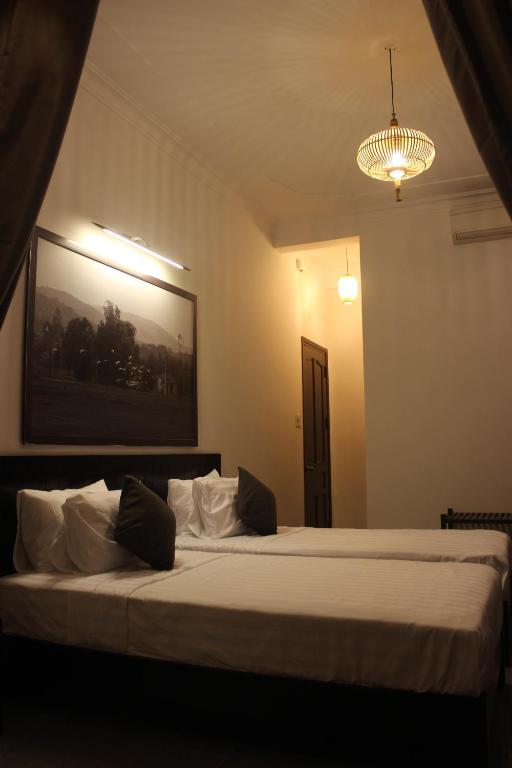 Postel nebo postele na pokoji v ubytování Hoi An Viet House Homestay