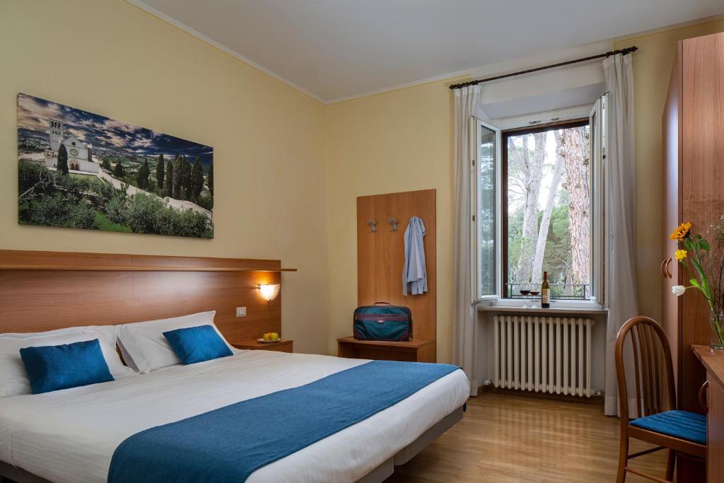 Posteľ alebo postele v izbe v ubytovaní Hotel Sacro Cuore