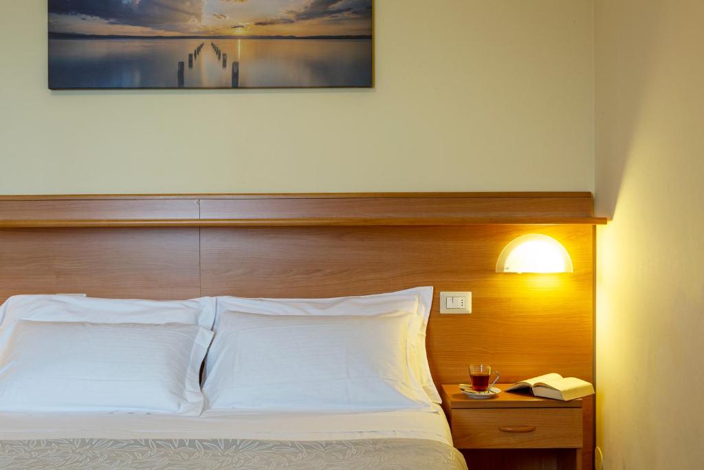 Posteľ alebo postele v izbe v ubytovaní Hotel Sacro Cuore