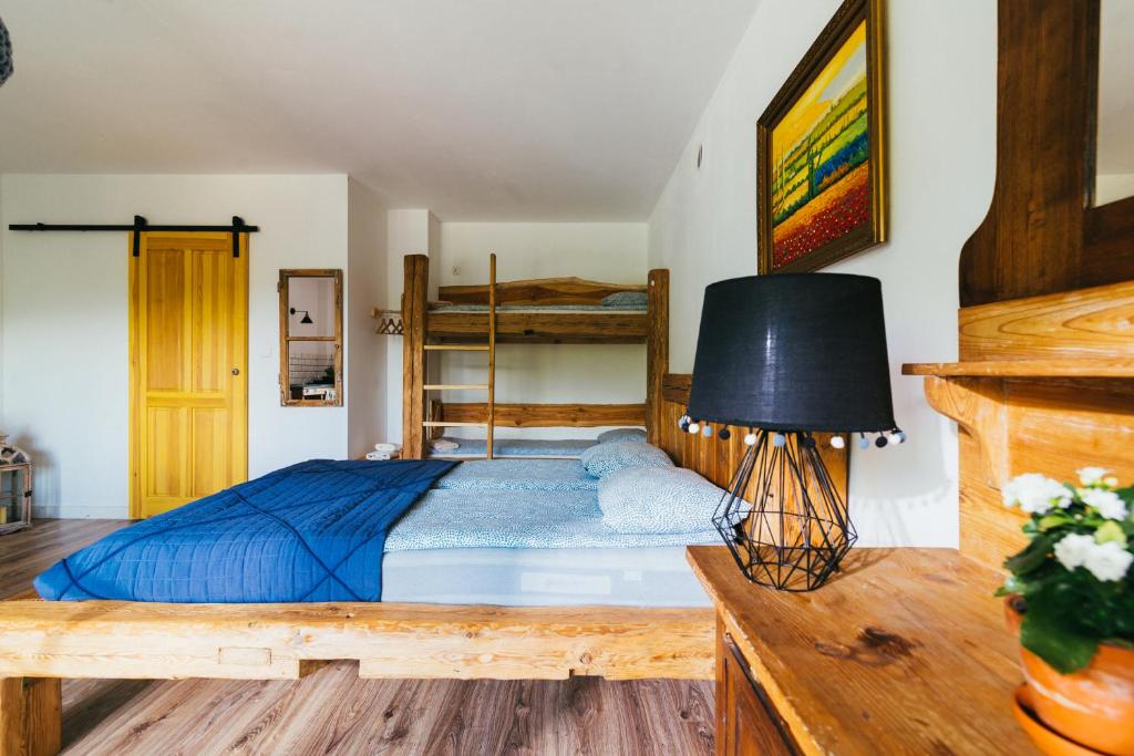 Posteľ alebo postele v izbe v ubytovaní Apartamenty na Pastwisku