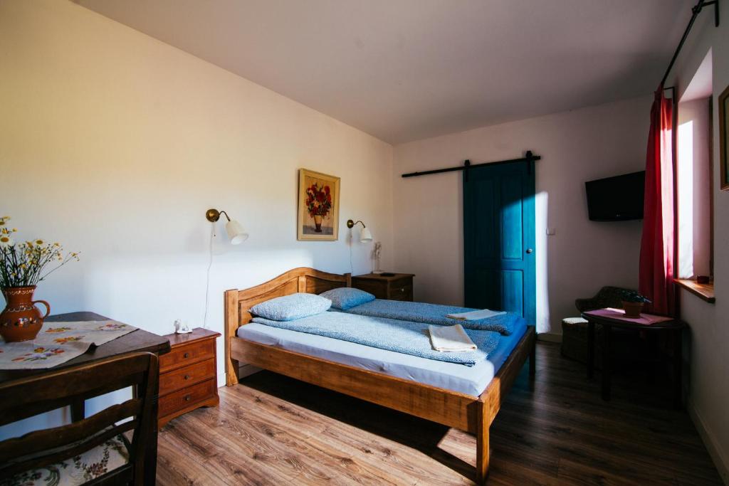 Posteľ alebo postele v izbe v ubytovaní Apartamenty na Pastwisku
