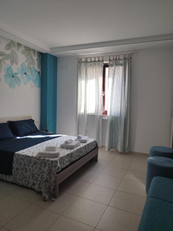 A bed or beds in a room at Massanè Casa Vacanza