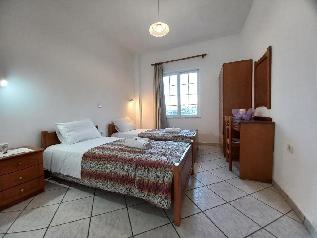 Posteľ alebo postele v izbe v ubytovaní Babis Apartments