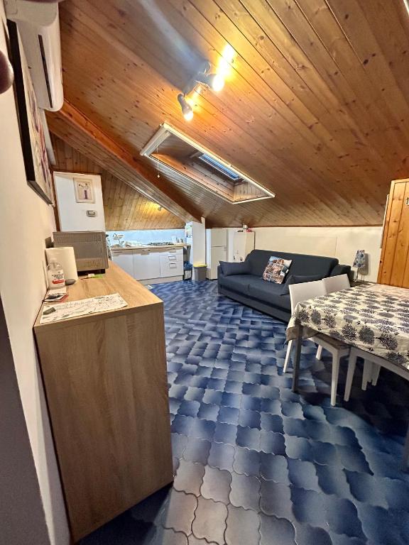 a living room with a couch and a table at La Moretta in Levanto