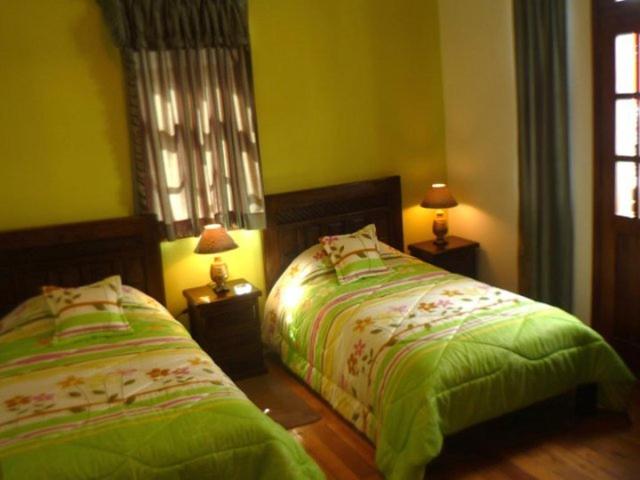 Postel nebo postele na pokoji v ubytování Hostal del Piamonte