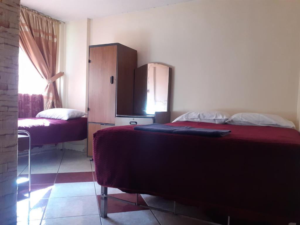 Postel nebo postele na pokoji v ubytování Hostal El Auténtico Diamante
