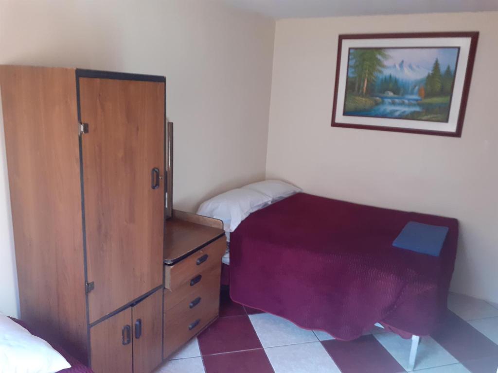 Postel nebo postele na pokoji v ubytování Hostal El Auténtico Diamante